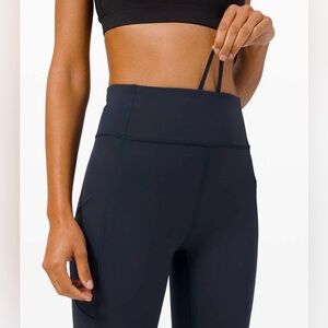 LULULEMON SIZE 6 INVIGORATE H/R CROP/ TRUE NAVY